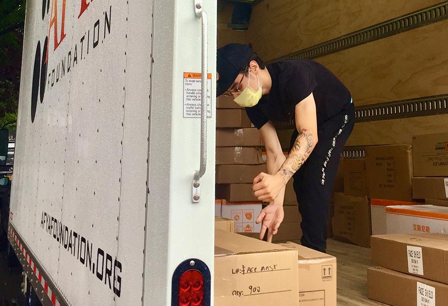 Volunteer loading up a truck